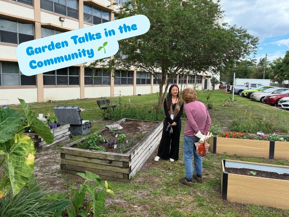 Two people talking in the garden. Garden talks in the community.