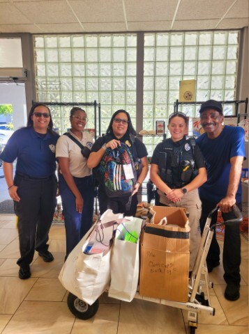 The Winter Park Police posing with school supplies.