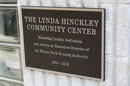 The Lynda Hinckley Community Center Plaque on a building.