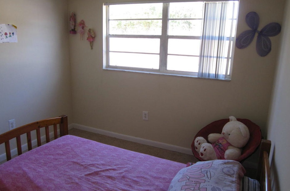 A twin bed is made up with sheets from the cartoon show BRATZ in the three-bedroom rental.