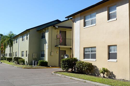 An American flag waves from the doorway of a rental at Tuscany at Aloma.