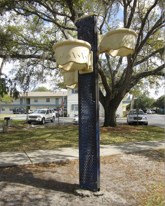 A metal and plastic basketball goal with 3 plastic baskets.