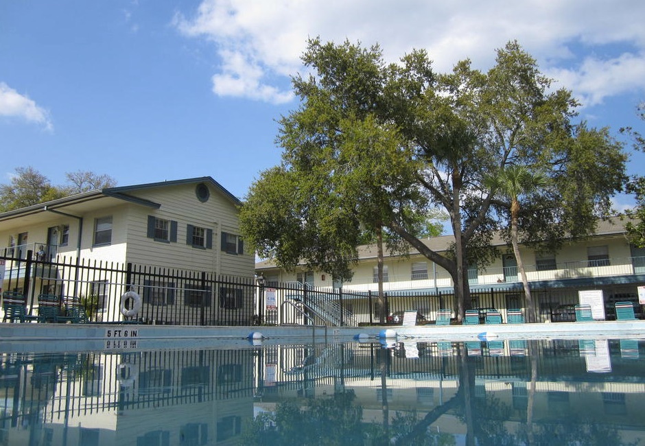 A large black fence enclosed the pool area. 