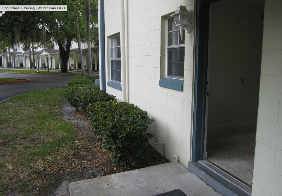 The outside door frame, window trim, and guttering are all painted to match. 