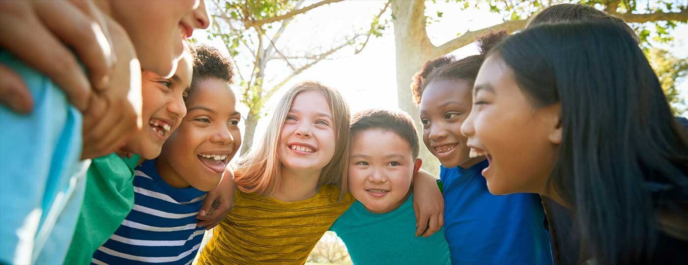 Smiling children in a huddle