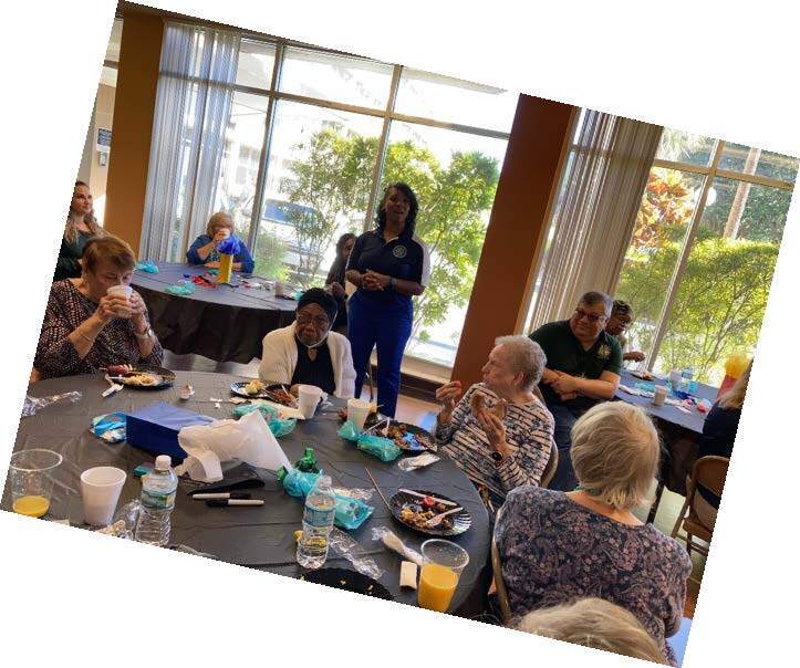 Community Appreciation Breakfast table with attendees eating