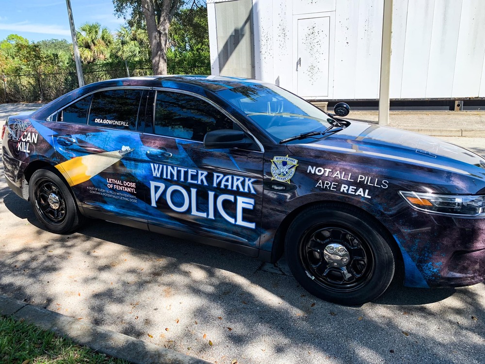 Winter Park police car with "One Pill Can Kill" message 
