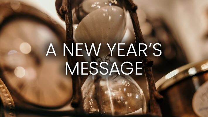 A New Year's Message banner with hour glass background