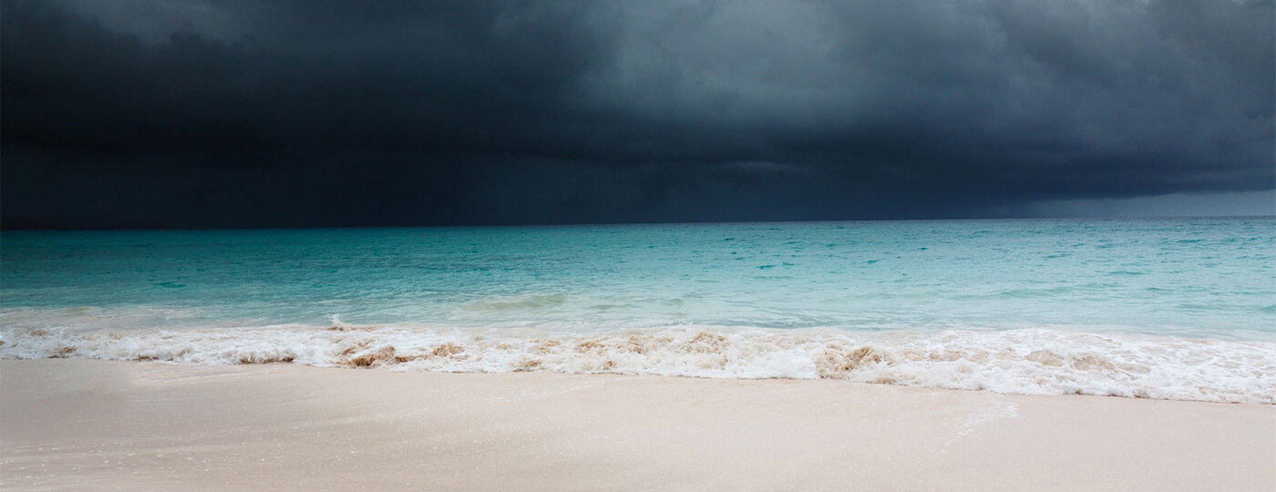 A dark and stormy beach line.