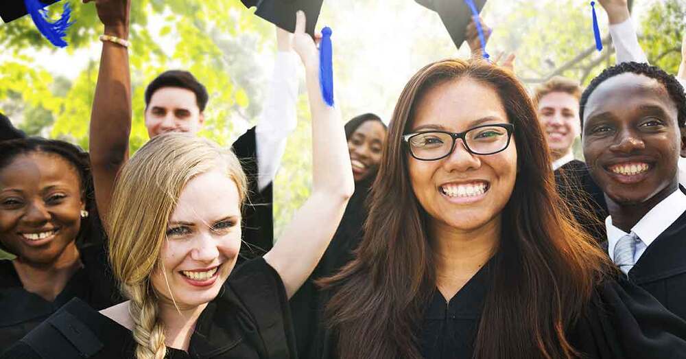 A group of college graduates at a ceremony.