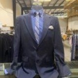 A nice suit on a mannequin torso.