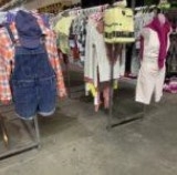 Several rows of racks of clothes.