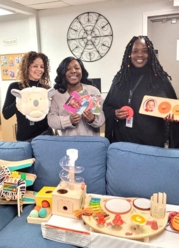 Wanda Grimes, Janice Kinsler and Irelisse Gomez with a donation of toys from Commissioner Elaine Clark.