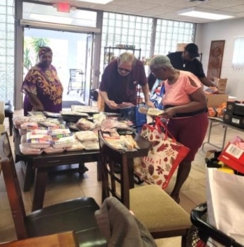 Residents getting items from the food bank.