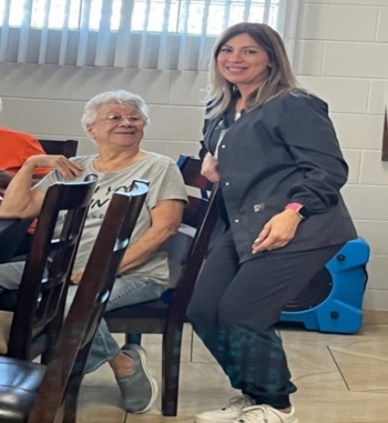 Two ladies next to each other.