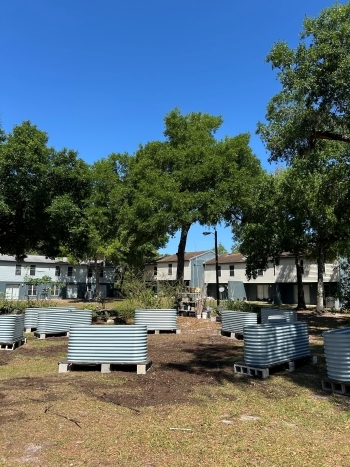 Empty planters in the Community Garden