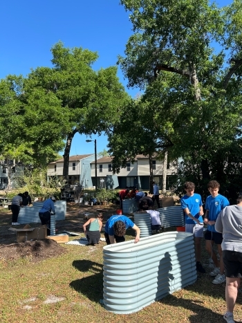 People working on the planters in the Community Garden 