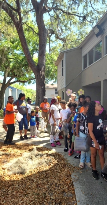 A lineup of people standing outside lined up for the Easter Egg Hunt.