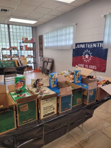 Tables full of boxes of food.