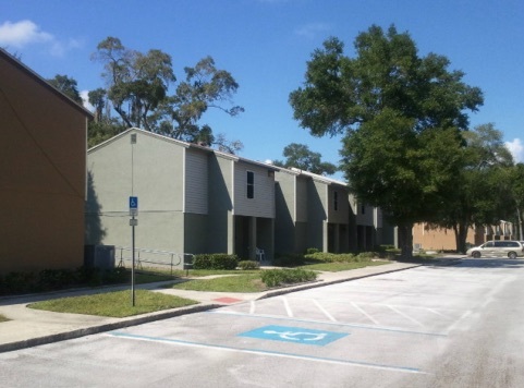 A view of a parking lot that is in front of the apartments at the Meadows. 