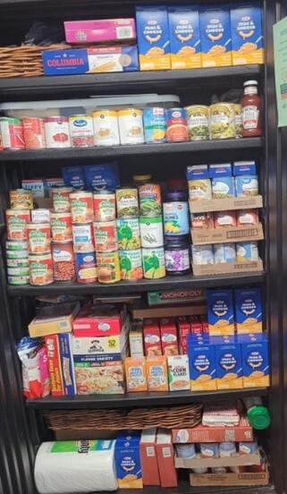 Pantry full of packaged food.