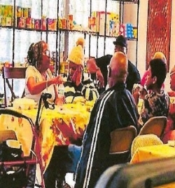 Several people seated at a table for Thanksgiving meal.