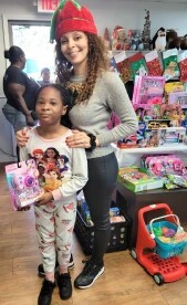 A woman and child posing and smiling for a picture.